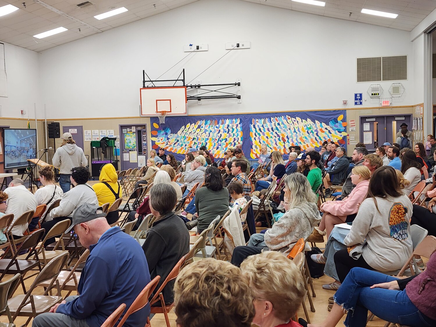 Crowd fills McKenny Elementary gymnasium during Oct. 12, 2026, school closure hearing